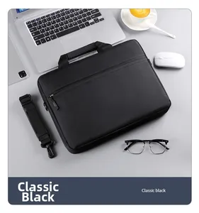 Classic black business laptop bag with adjustable shoulder strap and office accessories