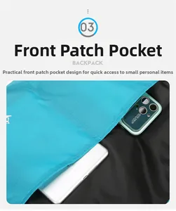 Detailed view of the front pocket of a blue nylon bag holding a phone and power bank