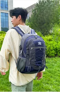Detail of outdoor backpack with breathable mesh side pockets and elastic cord system