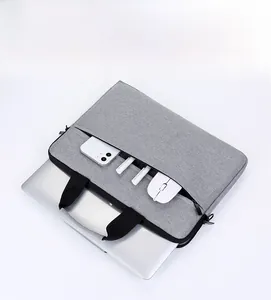 Detail view of laptop bag internal compartments with phone, mouse and pen storage