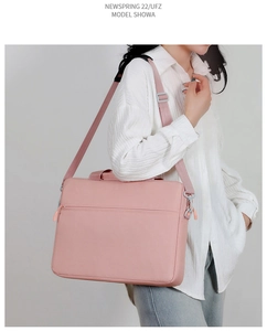 Minimalist pink laptop messenger bag worn by model for business and commute use