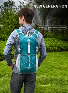 Close-up of lightweight cycling backpack with bungee cords on a green field