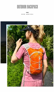 Outdoor cycling hydration backpack in bright orange with adjustable bungee cords