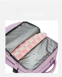 Detail view of purple travel bag featuring a waterproof wet and dry separation compartment