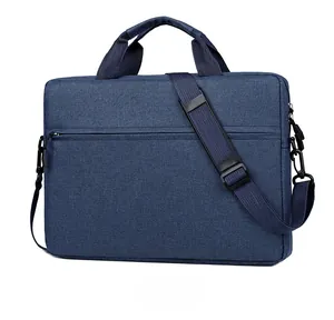 Side view of dark blue business laptop bag with top handles and adjustable shoulder strap