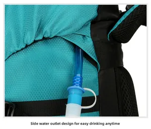 Detail of the side hydration port and blue water tube on a hiking backpack