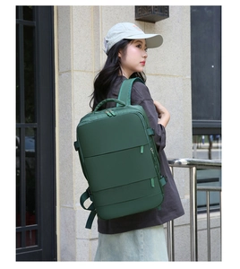 Deep green waterproof travel backpack with large capacity shown in an outdoor lifestyle shot