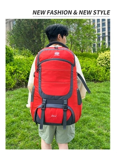 Close-up of 85L hiking backpack featuring red and grey panels with durable nylon texture