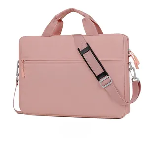 Micro side view of a pink laptop bag showing dual handles and adjustable shoulder strap