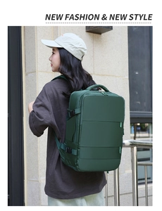 Outdoor shot of a large dark green travel backpack with side buckles and ergonomic straps