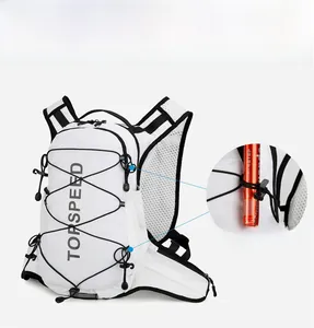 Detail of the side bungee cord system securing trekking poles on the white hiking backpack
