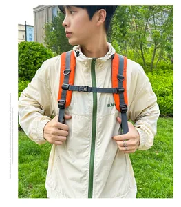 Detail of adjustable orange padded shoulder straps with D-ring and gray chest buckle