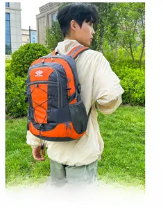 Detail of outdoor backpack with orange accents, breathable mesh straps and bungee cords