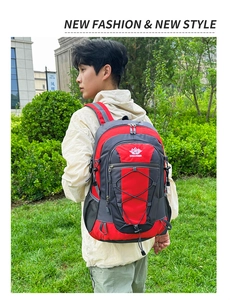 Outdoor hiking backpack with red and gray contrast, showing ergonomic side-carry view