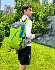 Side view of a green 40L hiking backpack with mesh water bottle pocket and blue zippers