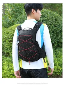 Close-up of hydration vest with red bungee cords and breathable mesh straps