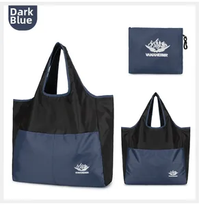 Deep blue foldable travel bag showing full size and compact storage form in detail