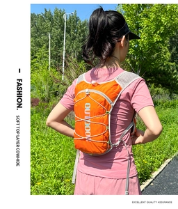 Detail of lightweight orange hydration backpack with breathable mesh shoulder straps