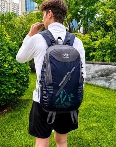 Ergonomic shoulder straps and breathable mesh side pocket on 40L hiking backpack