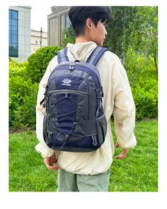 Detail view of large capacity hiking backpack with front bungee system and side mesh pockets