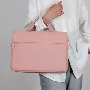Pink minimalist laptop handbag shown on model for business and office use