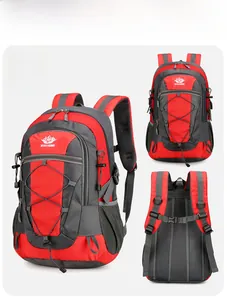 Detail view of red hiking backpack showing elastic cords, mesh pockets and padded straps