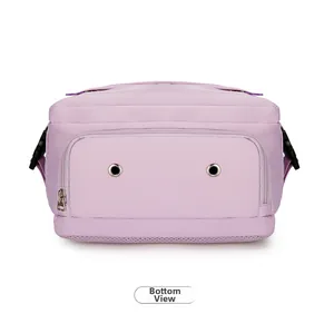 Detail of backpack bottom featuring zipper compartment and metal ventilation eyelets