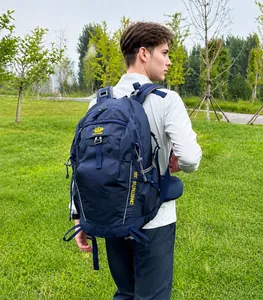 Side view of deep blue 35L hiking backpack with padded waist support and side logos