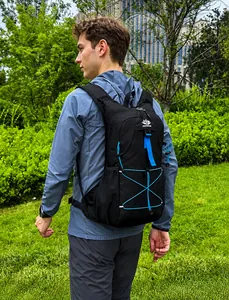 Detail view of the elastic bungee cord system on the black and blue cycling backpack