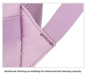 Detail of reinforced bartack stitching on purple backpack straps for extra load capacity