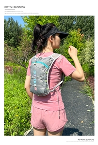 Outdoor hydration pack detail showing lightweight design on a runner in grey and blue colors