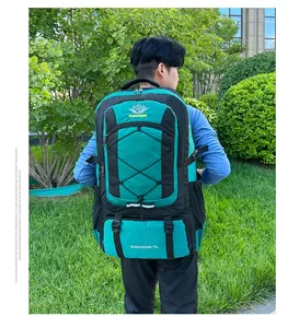 Outdoor 75L nylon hiking backpack in green and black on model in park setting