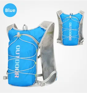 Detail of blue outdoor hydration vest showing breathable mesh straps and elastic cords
