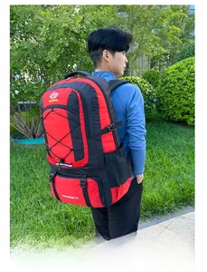 Detail view of 75L red and black hiking backpack with side mesh pockets and buckles