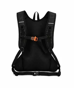 Detail of breathable mesh back panel and orange safety buckle on black cycling backpack