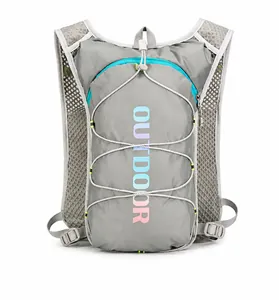 Detail of grey hydration vest featuring breathable mesh straps and blue zipper accents