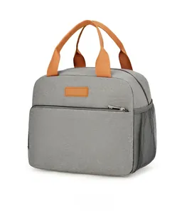 Detailed side view of grey waterproof lunch bag with orange handles and side mesh pocket