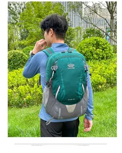 Outdoor 40L emerald green hiking backpack worn by a man in a scenic park setting