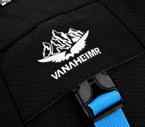 Detailed close-up of VANAHEIMR logo embroidery on black honeycomb ripstop cycling backpack