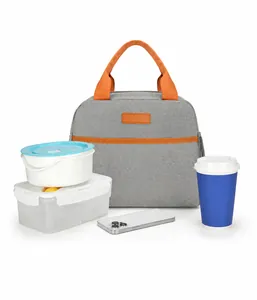 Spacious grey insulated lunch bag with orange handles showing large interior capacity