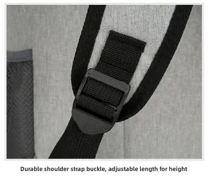 Detail of sturdy black plastic buckle with adjustable shoulder strap on grey backpack