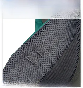 Detail of breathable honeycomb mesh padding on outdoor backpack shoulder straps