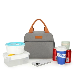 Grey insulated lunch bag with brown handles showing large storage capacity for food containers