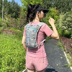 Lightweight grey nylon hydration backpack for running and cycling with outdoor mesh straps