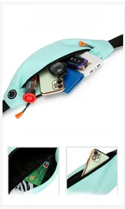 Detail view of large capacity mint green running belt showing internal zipper pockets