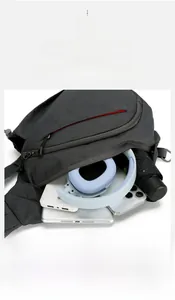 Detail view of the spacious main compartment of the grey oxford sling bag showing large capacity