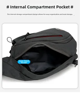 Detail view of the charcoal grey Oxford chest bag inner storage compartments and zip