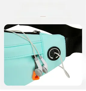 Detail shot of the mint green sports waist pack featuring a dedicated headphone jack port