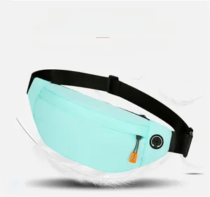 Detail of lightweight mint green running belt with headphone port and waterproof zipper