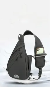 Detail view of Oxford fabric chest bag featuring a shoulder strap pocket for smartphones